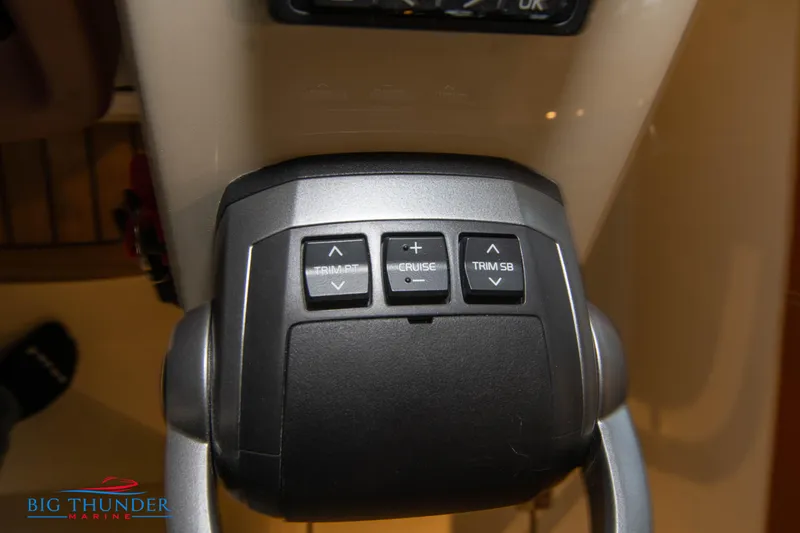 Slide: The Image of Close-up of 2024 Capoforte SX280I boat control panel with trim and cruise buttons. - 40