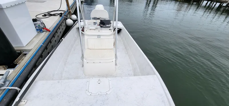 Slide: The Image of 2019 Wagner Catamaran Coaches boat docked at marina, view of the deck and console. - 12