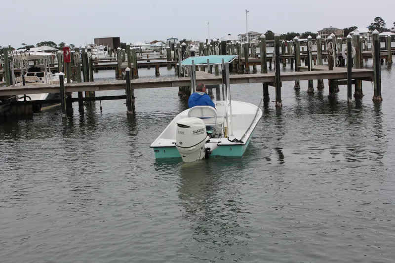 Slide: The Image of 2019 Wagner Catamaran Coaches boat docked at a marina. - 5