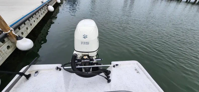 Slide: The Image of 2019 Wagner Catamaran Coaches boat with Suzuki 115 outboard motor at dock. - 7