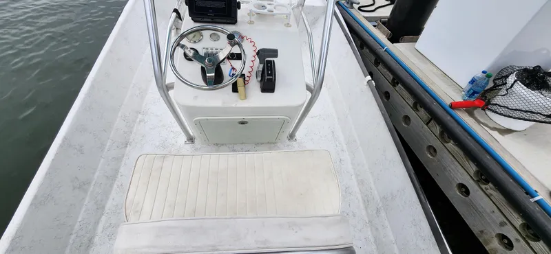 Slide: The Image of 2019 Wagner Catamaran Coaches boat interior with steering console and seating. - 8