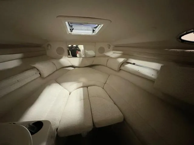 Slide: The Image of Interior cabin of a 2001 Sea Ray 260 Sundancer boat with beige upholstery. - 11