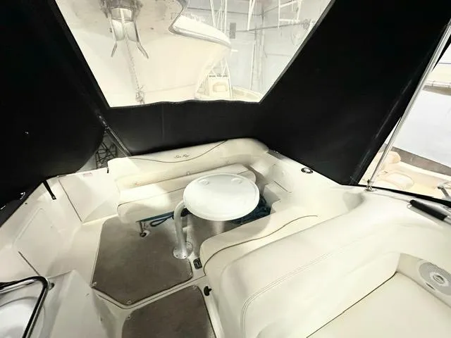 Slide: The Image of Interior of 2001 Sea Ray 260 Sundancer boat with seating and table. - 3