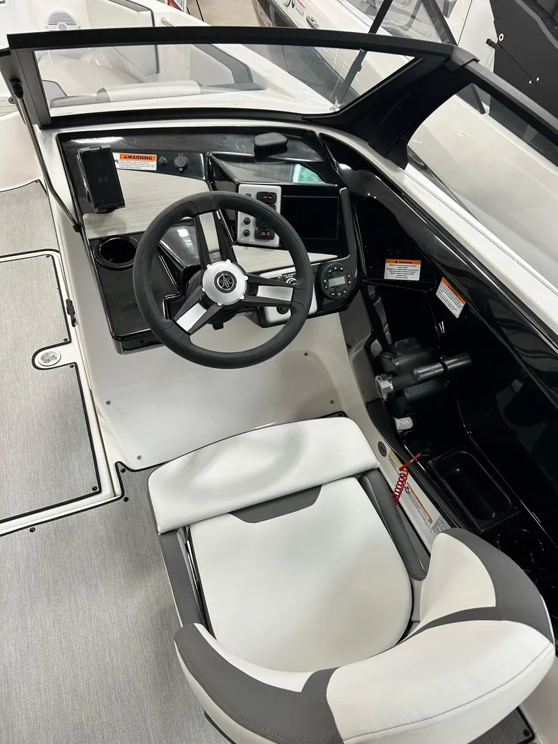 Slide: The Image of 2024 Yamaha Boats SX 220 cockpit with steering wheel and control panel. - 3