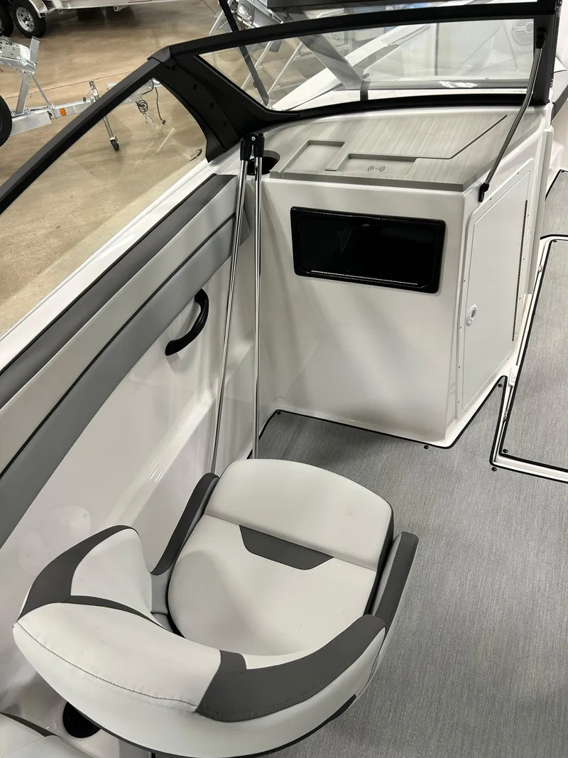 Slide: The Image of 2024 Yamaha Boats SX 220 interior cockpit with seating and storage. - 4