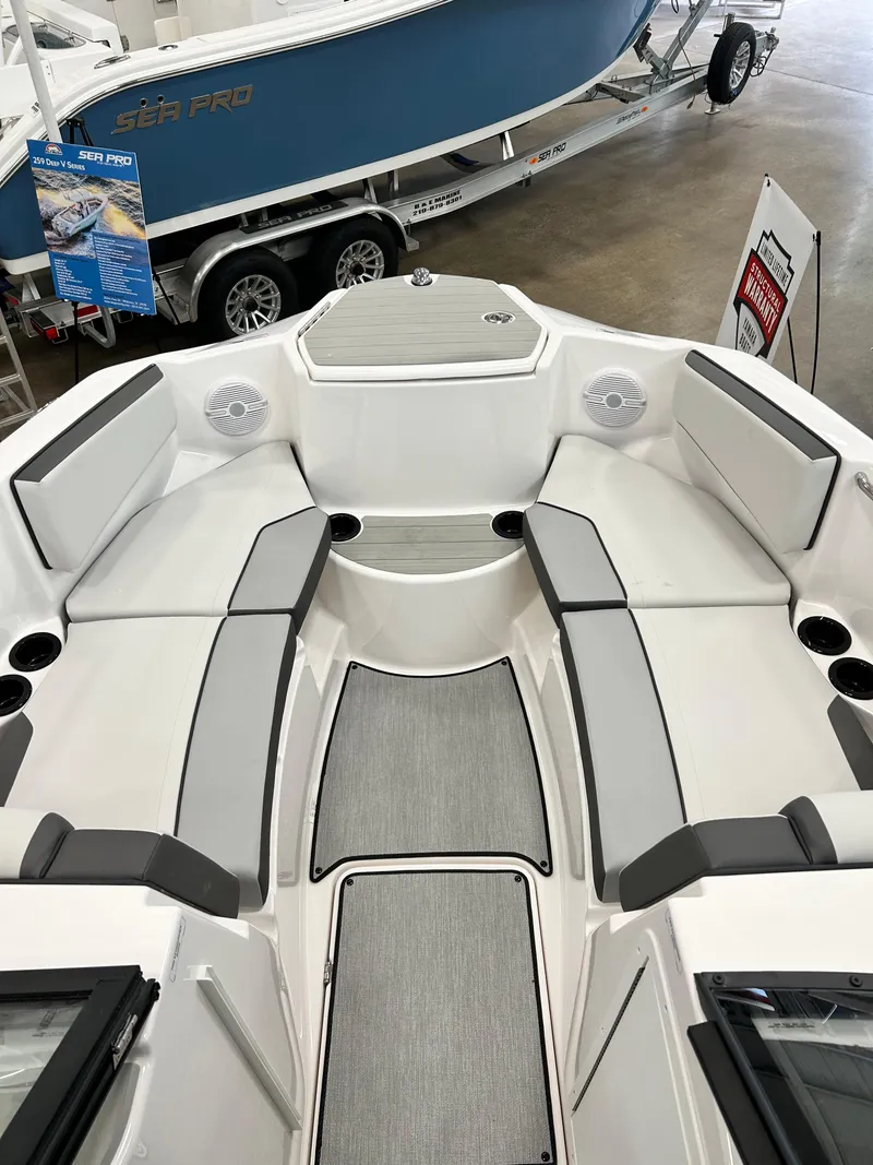 Slide: The Image of 2024 Yamaha Boats SX 220 interior seating and deck view. - 5