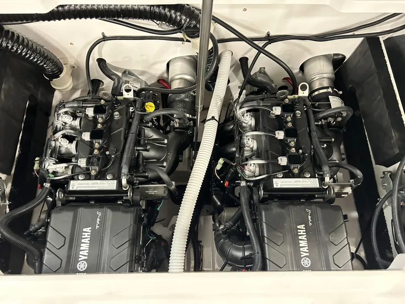 Slide: The Image of Yamaha Boats SX 220 2024 twin engines in engine compartment. - 7