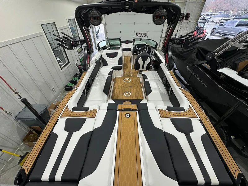 Slide: The Image of 2024 MasterCraft XT24 boat interior with luxurious seating and modern design. - 14