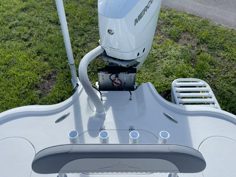 Slide: The Image of 2025 Turner Boatworks 2500 VS with Mercury outboard motor, rear deck view. - 2