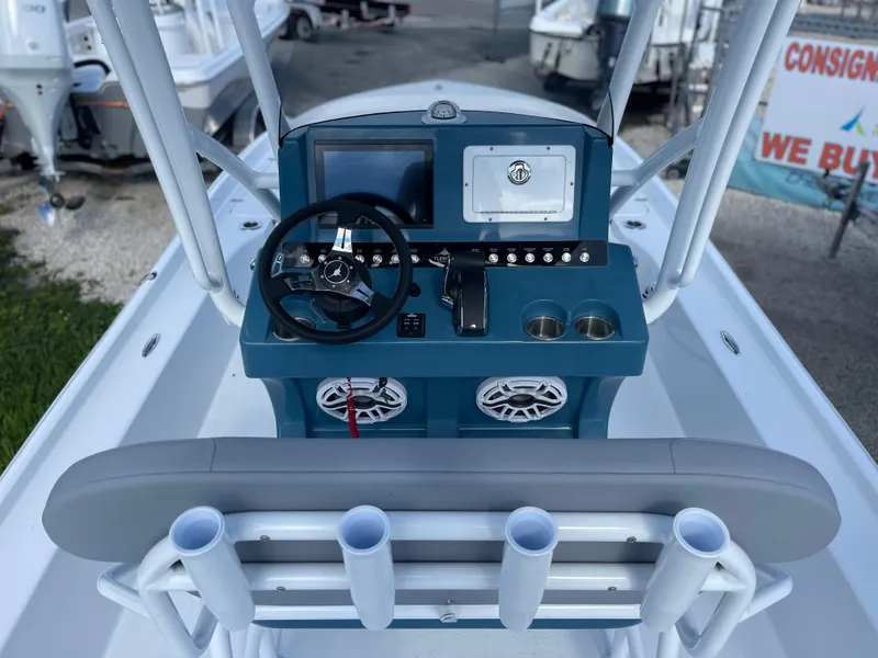 Slide: The Image of Turner Boatworks 2500 VS 2025 model boat console with steering wheel and controls. - 4