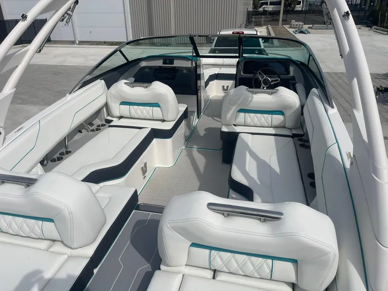 Slide: The Image of 2024 Regal LS4 boat interior with white leather seating and modern design. - 12