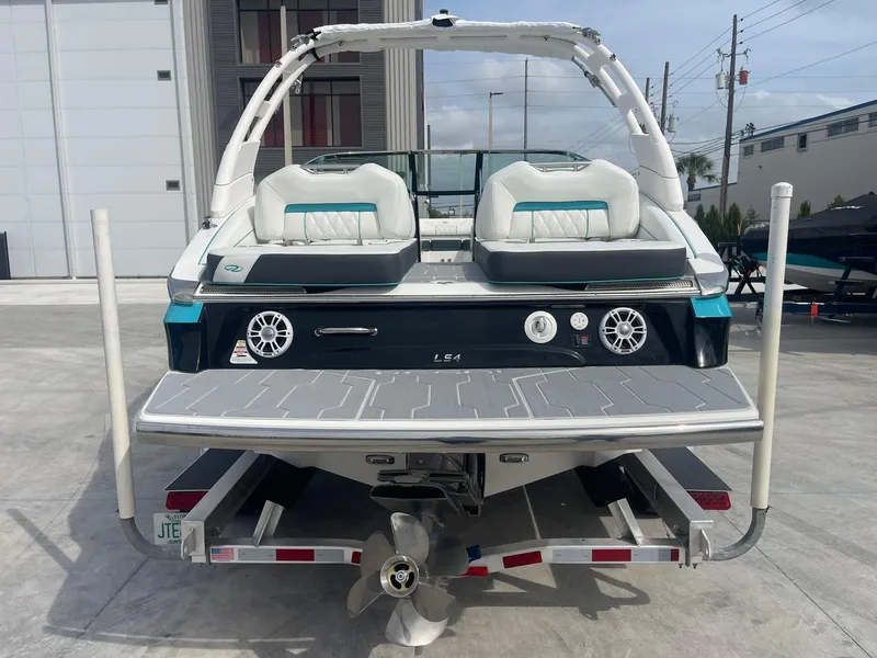 Slide: The Image of 2024 Regal LS4 boat rear view with swim platform and dual seats. - 3