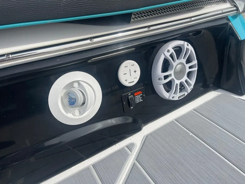 Slide: The Image of 2024 Regal LS4 boat audio system and control panel. - 5