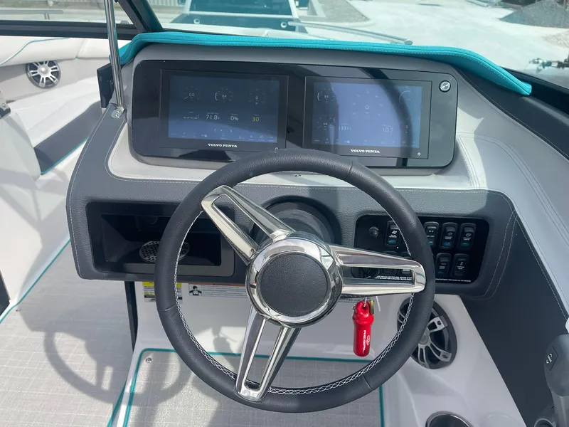 Slide: The Image of 2024 Regal LS4 boat dashboard with steering wheel and digital displays. - 9