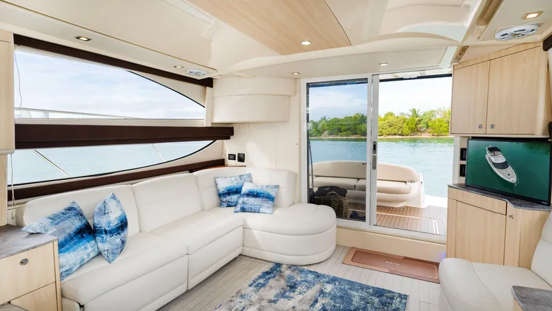 Slide: The Image of Luxurious interior of a 2012 Meridian Sedan Bridge yacht with waterfront view. - 23