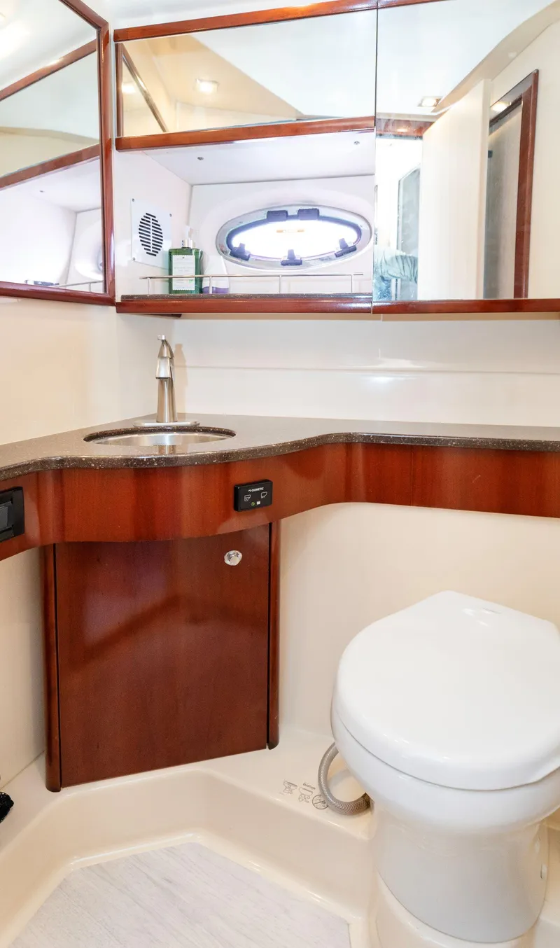 Slide: The Image of Luxurious bathroom in a 2012 Meridian Sedan Bridge yacht with modern fixtures. - 34