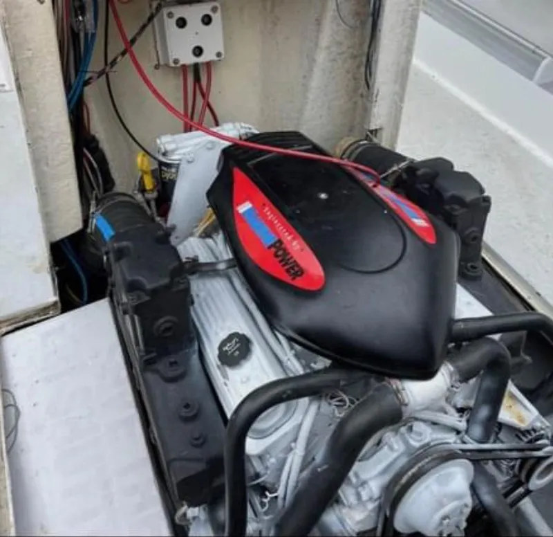 Slide: The Image of 1968 Wahoo Alglas 25 boat engine compartment with a powerful inboard motor. - 11