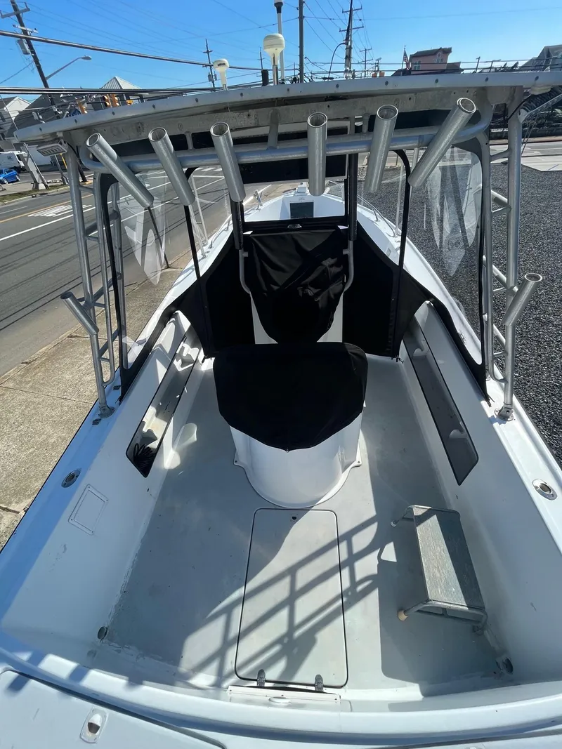 Slide: The Image of 1968 Wahoo Alglas 25 boat with rod holders and seating. - 14