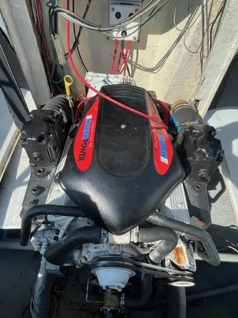 Slide: The Image of 1968 Wahoo Alglas 25 boat engine compartment with visible wiring and components. - 19