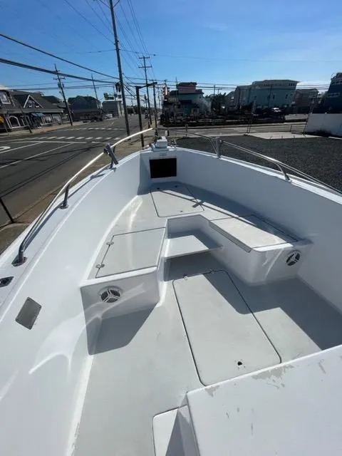 Slide: The Image of 1968 Wahoo Alglas 25 boat deck with seating and storage compartments. - 23