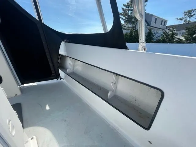 Slide: The Image of Interior view of a 1968 Wahoo Alglas 25 boat showing storage compartment. - 25