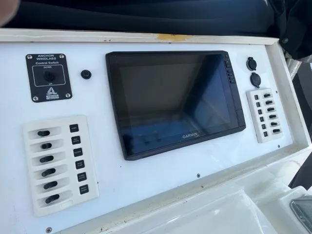 Slide: The Image of Control panel of a 1968 Wahoo Alglas 25 boat with Garmin display. - 30
