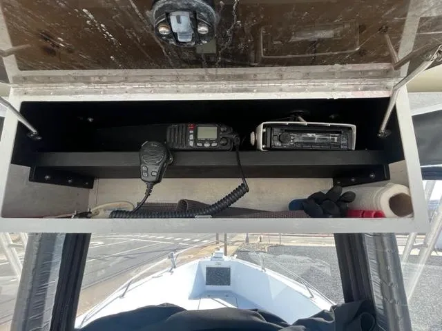 Slide: The Image of 1968 Wahoo Alglas 25 boat dashboard with radio and communication equipment. - 31