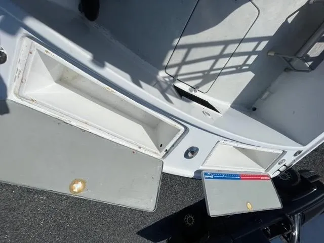 Slide: The Image of 1968 Wahoo Alglas 25 boat interior with open storage compartments. - 41