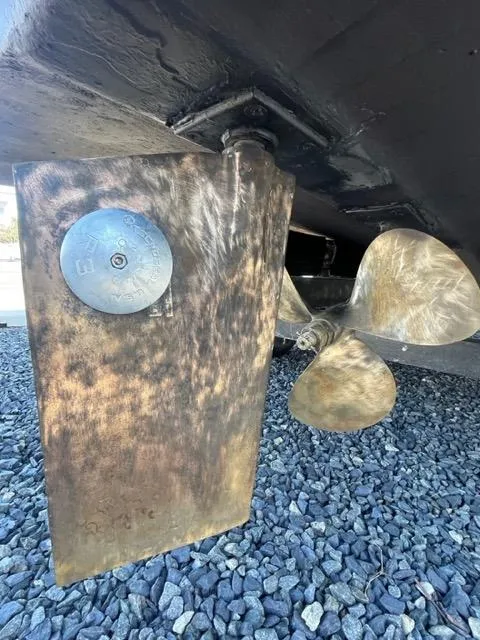 Slide: The Image of Close-up of the propeller and rudder of a 1968 Wahoo Alglas 25 boat. - 46