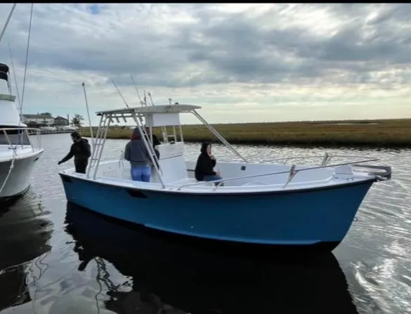 Slide: The Image of 1968 Wahoo Alglas 25 boat on water with people onboard. - 6