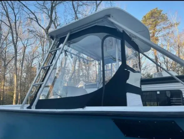 Slide: The Image of 1968 Wahoo Alglas 25 boat with canopy and ladder in wooded area. - 8
