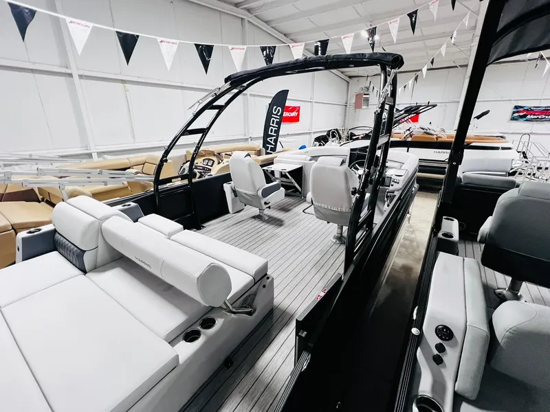 Slide: The Image of 2024 Harris Sunliner 250 Sport pontoon boat interior with luxurious seating. - 11