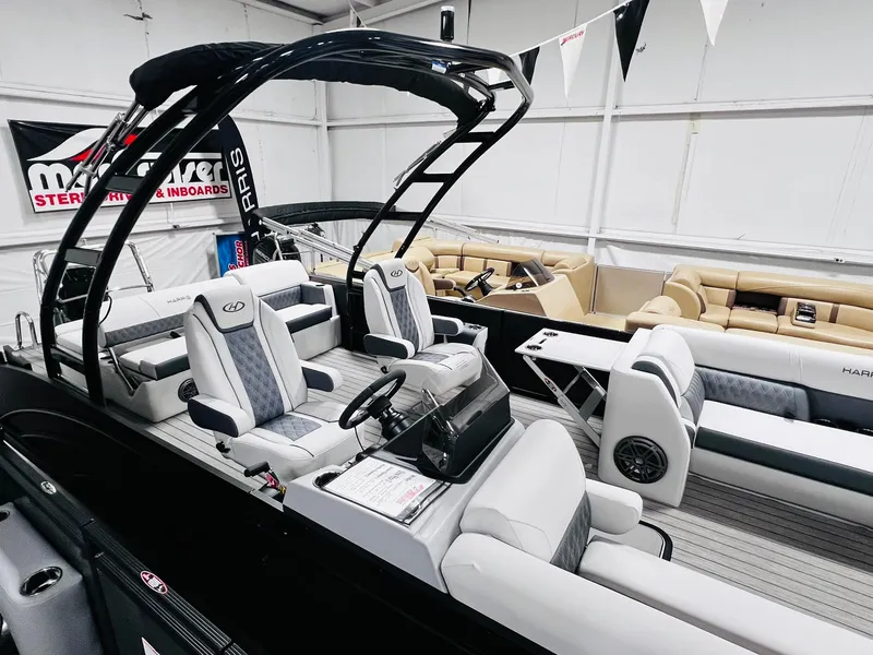 Slide: The Image of 2024 Harris Sunliner 250 Sport pontoon boat interior with luxury seating and modern design. - 16