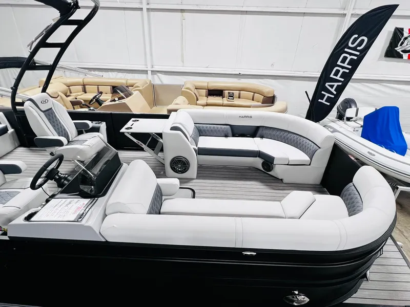 Slide: The Image of 2024 Harris Sunliner 250 Sport pontoon boat with luxurious seating and modern design. - 17