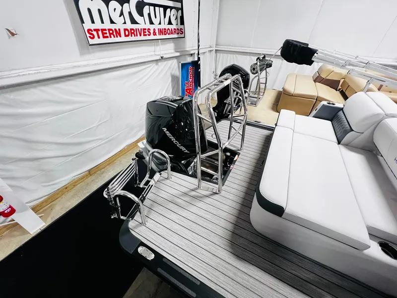 Slide: The Image of 2024 Harris Sunliner 250 Sport pontoon boat with Mercury outboard motor. - 22