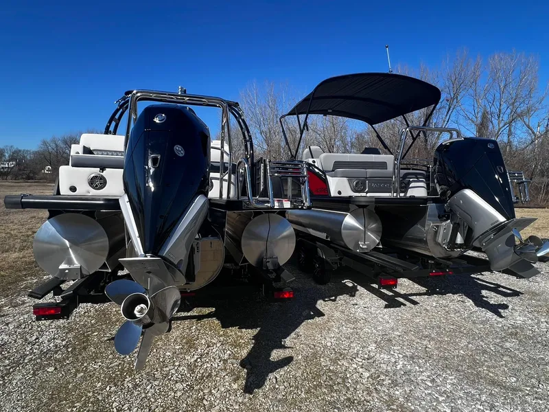 Slide: The Image of 2024 Harris Sunliner 250 Sport pontoon boat with dual outboard motors. - 27
