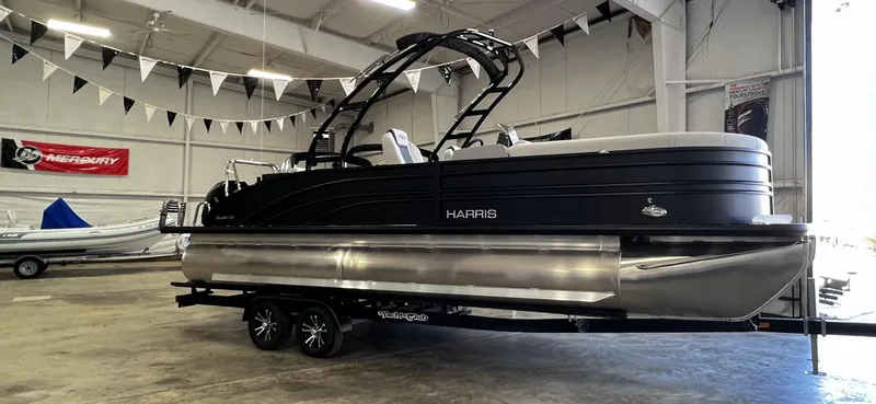 Slide: The Image of 2024 Harris Sunliner 250 Sport pontoon boat in showroom. - 4