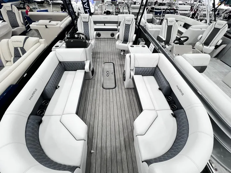 Slide: The Image of 2024 Harris Sunliner 250 Sport pontoon boat with luxurious seating and modern design. - 5
