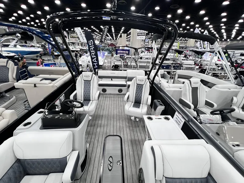 Slide: The Image of 2024 Harris Sunliner 250 Sport pontoon boat interior at a boat show. - 6