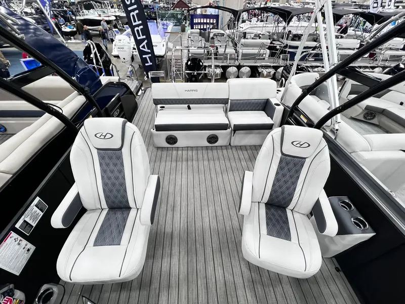 Slide: The Image of 2024 Harris Sunliner 250 Sport boat interior with luxury seating and modern design. - 7