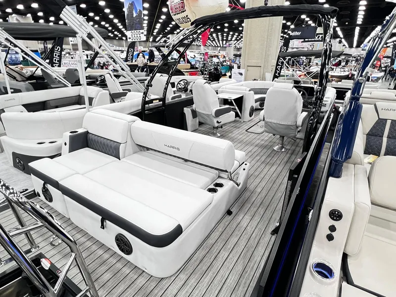 Slide: The Image of 2024 Harris Sunliner 250 Sport pontoon boat interior at a boat show. - 8