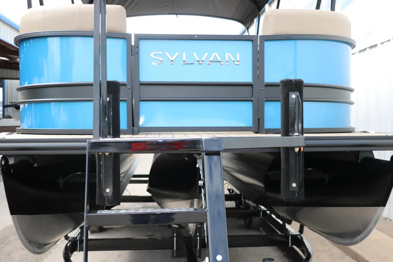 Slide: The Image of 2025 Sylvan Mirage X3 CLZ DH pontoon boat, rear view, blue exterior. - 10