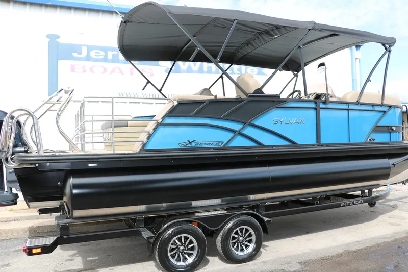 Slide: The Image of 2025 Sylvan Mirage X3 CLZ DH pontoon boat with canopy on trailer. - 15