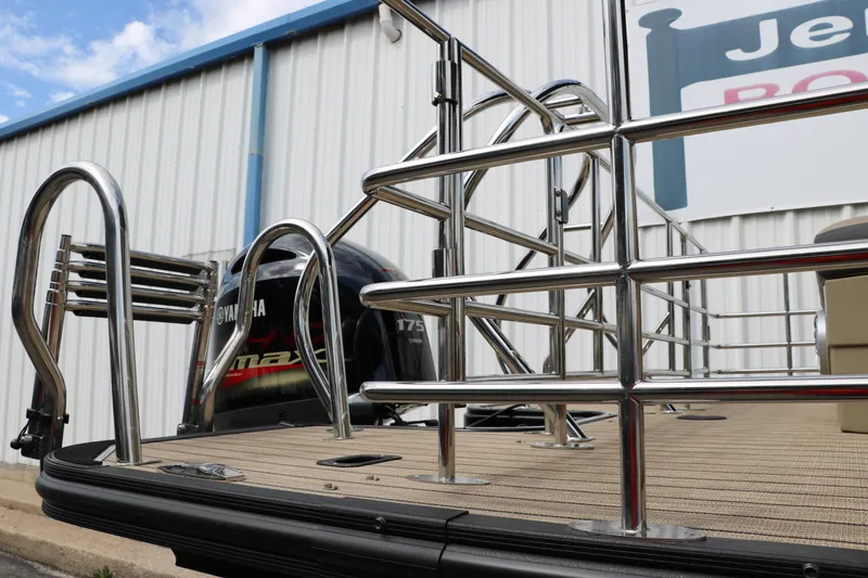 Slide: The Image of 2025 Sylvan Mirage X3 CLZ DH pontoon boat with Yamaha engine and stainless steel railings. - 17