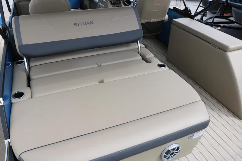 Slide: The Image of 2025 Sylvan Mirage X3 CLZ DH boat interior with beige seating and cup holders. - 22