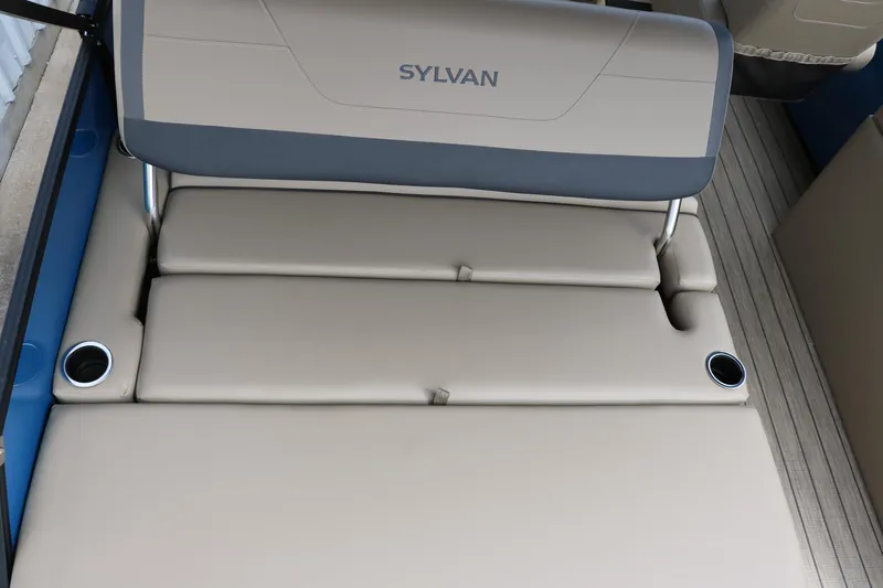 Slide: The Image of 2025 Sylvan Mirage X3 CLZ DH boat seating with cup holders, beige upholstery. - 24