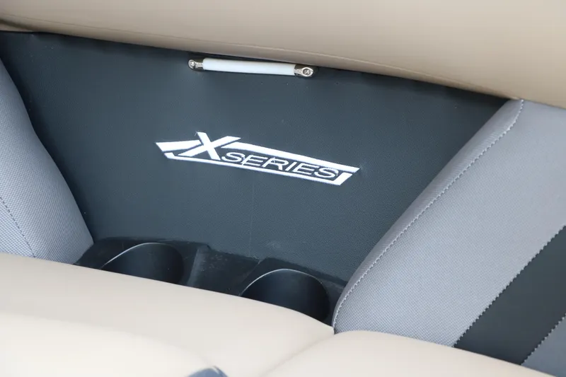Slide: The Image of 2025 Sylvan Mirage X3 CLZ DH interior with X-Series logo and cup holders. - 29