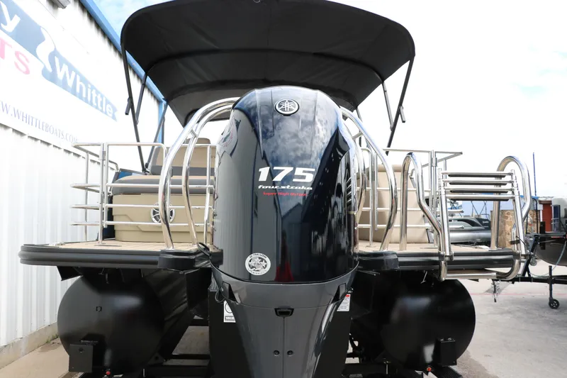 Slide: The Image of 2025 Sylvan Mirage X3 CLZ DH pontoon boat with 175 horsepower engine, rear view. - 3