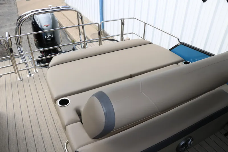 Slide: The Image of 2025 Sylvan Mirage X3 CLZ DH pontoon boat with beige seating and 175 horsepower engine. - 33