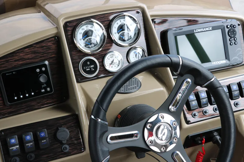Slide: The Image of Dashboard of 2025 Sylvan Mirage X3 CLZ DH with steering wheel and navigation system. - 38